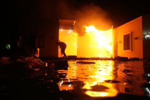 The U.S. Consulate in Benghazi is seen in flames during a protest